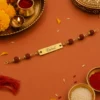 Rudraksha Rakhi with Name – Personalized Gold-Tone Name Plate Rakhi